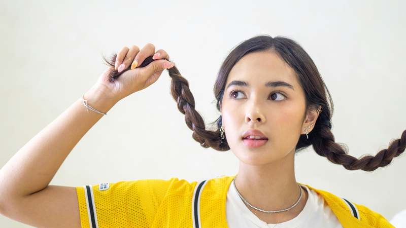 Close-up of two-strand twisted hairstyle with gold hair pins